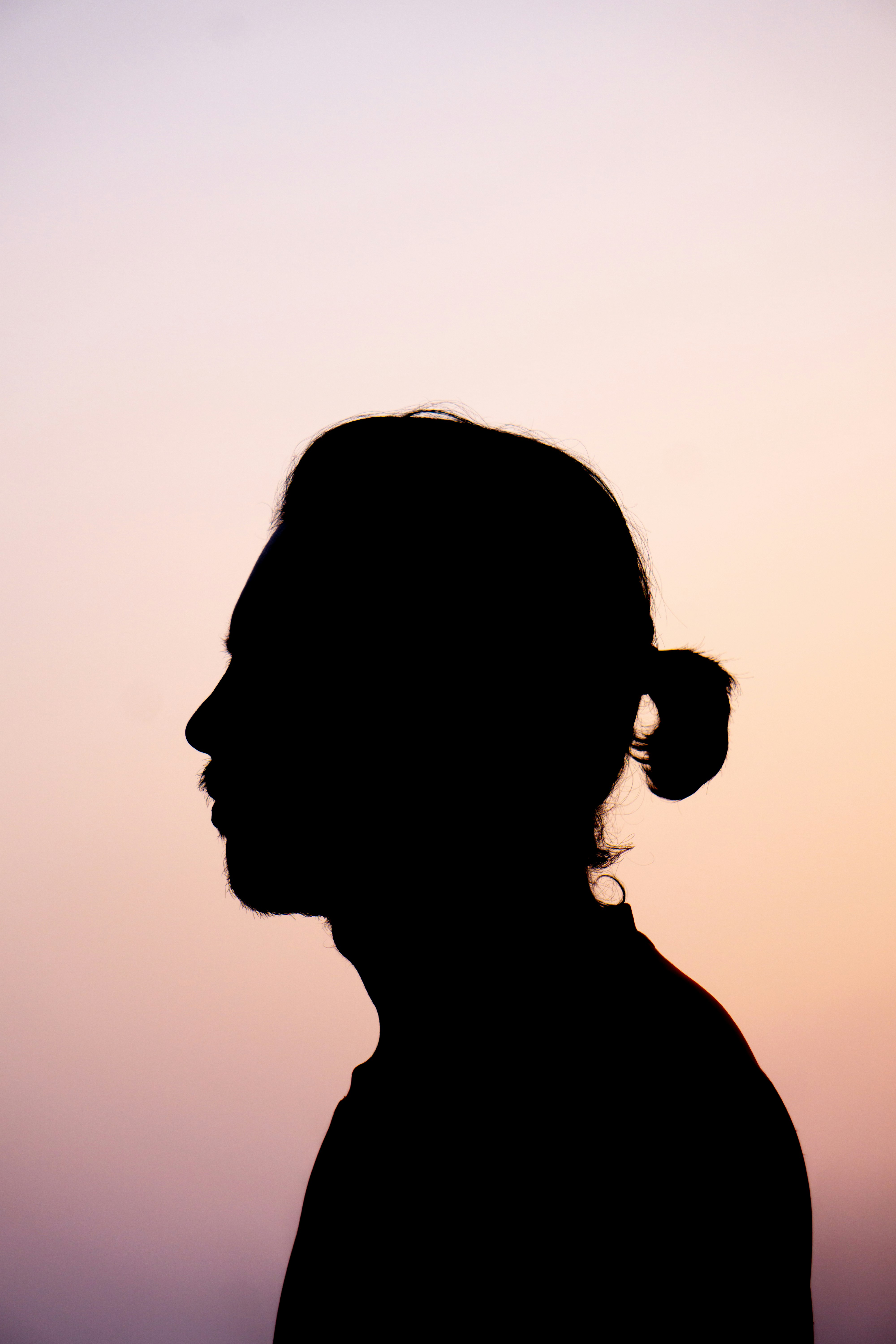 silhouette of woman during sunset